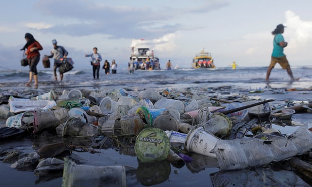  Tourists and local residents disembark a boat amid plastic rubbish in Sanur, Bali Photograph: Johannes Christo/Reuters