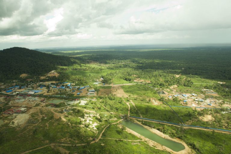 A drone photo shows a gold mine site and surrounding forest and farmland. Image courtesy of Mother Nature Cambodia