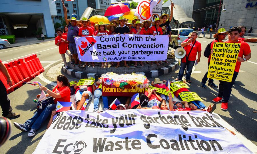 Activists from EcoWaste protest outside the Canadian embassy in Manila on May 21, 2019, to push the Trudeau government to speed up the removal of waste from Manila and Subic ports. Photo: AFP / Maria Salvador Tan