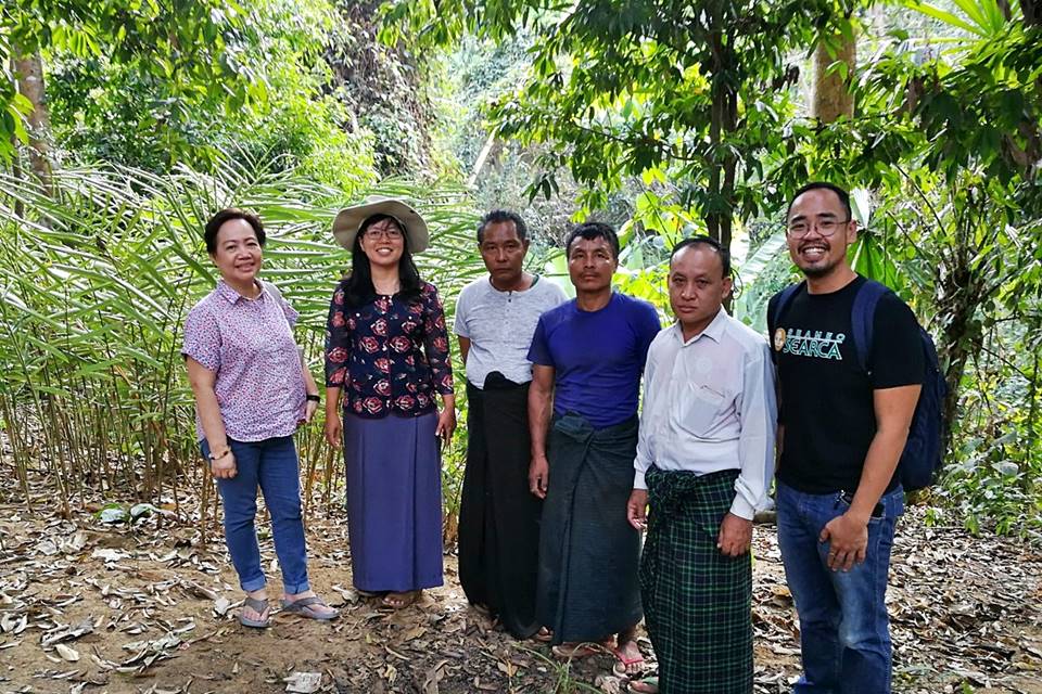 The ASRF PMO and Dr. Dr. Ei Ei Swe Hlaing, AWG-SF Focal Point and Assistant Director of FRI (second from left), with members of the village community in Than Daung Township.